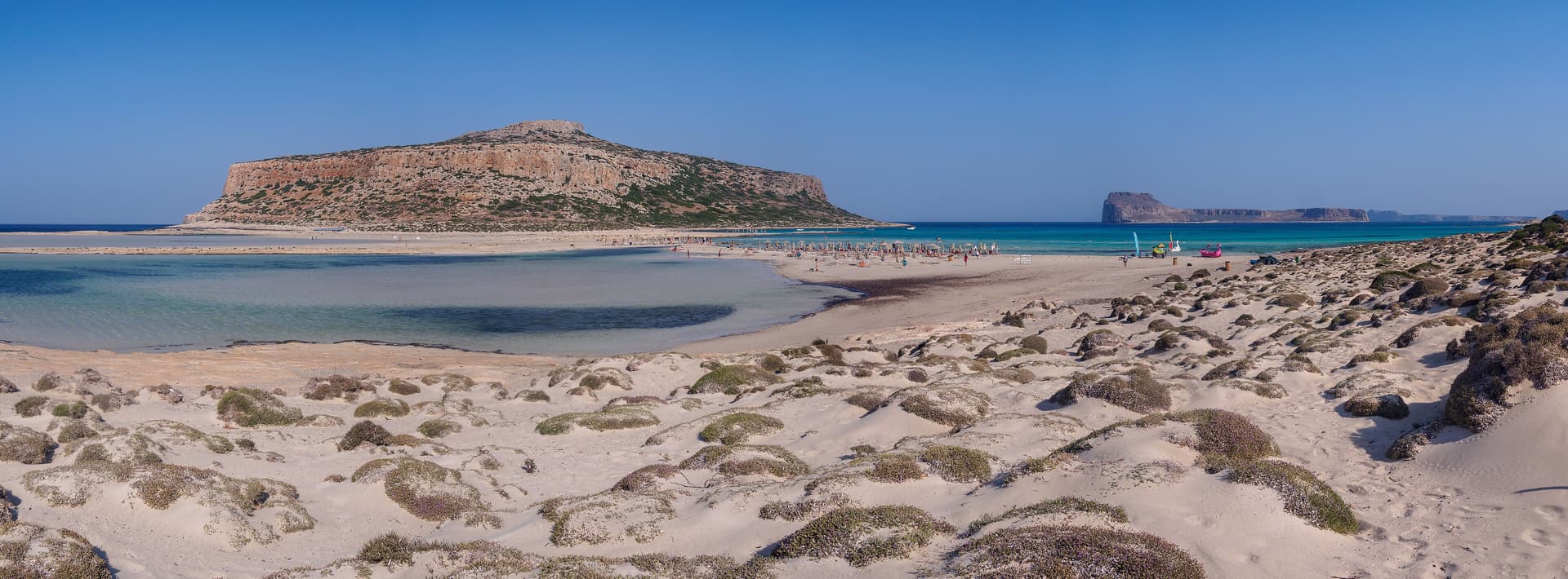 Balos lagoon stretching between pale sand, shallow water and Gramvousa