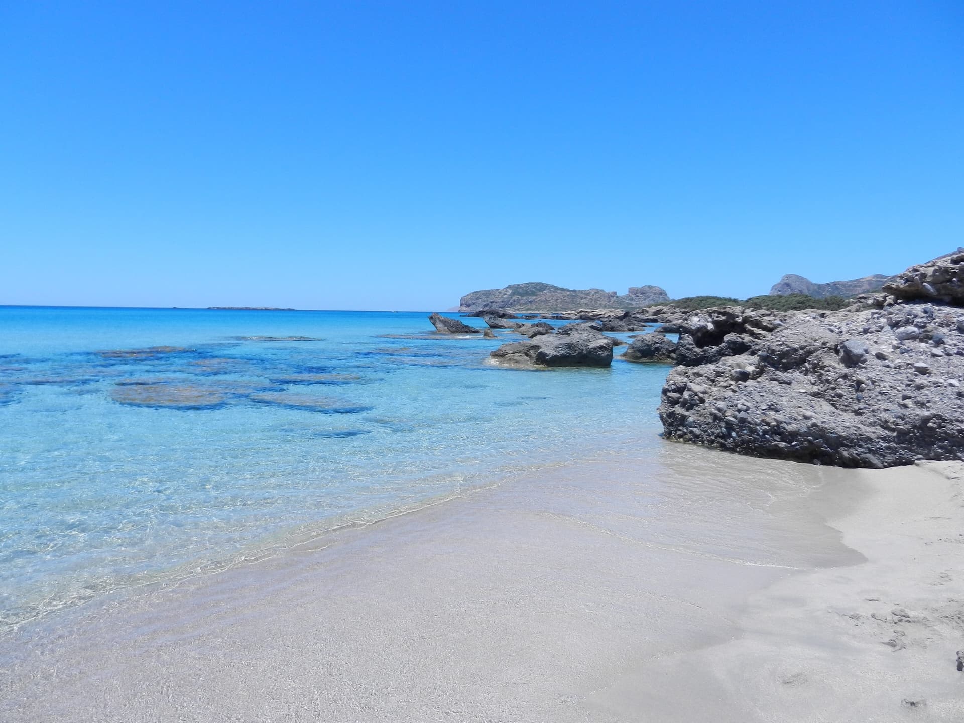 Clear turquoise shallows and pale sand at Falassarna on western Crete